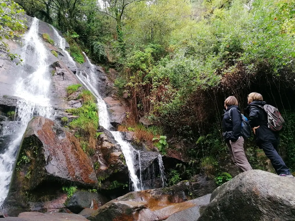 Two People seeing one of the waterfalls in Sever do Vouga -Visit center of Portugal